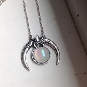 necklace with a moon and opal glass pendant